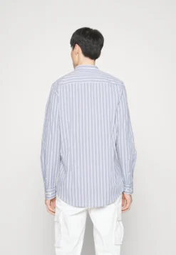 Pier One Muscle Fit Stand- Skjorte - Blue -Boutique mote herrebutikk 6f902e87935b415aa0482cac3fb832df scaled